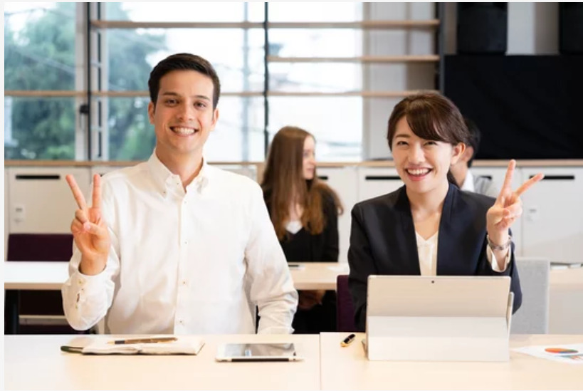 Japanese tutor and student laughing